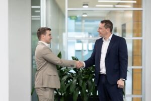 mortgage broker with client shaking hands