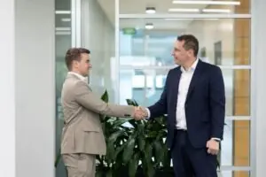 mortgage broker with client shaking hands