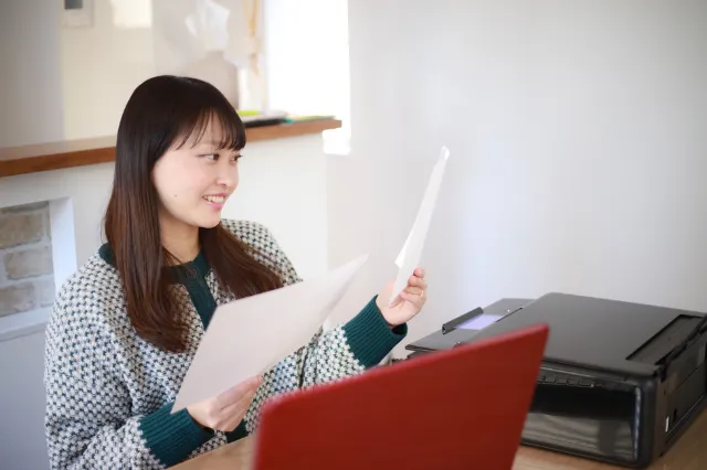 First-home buyer reviewing documents while planning smart auction tactics